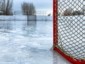 Hockey net on an empty, outdoor rink