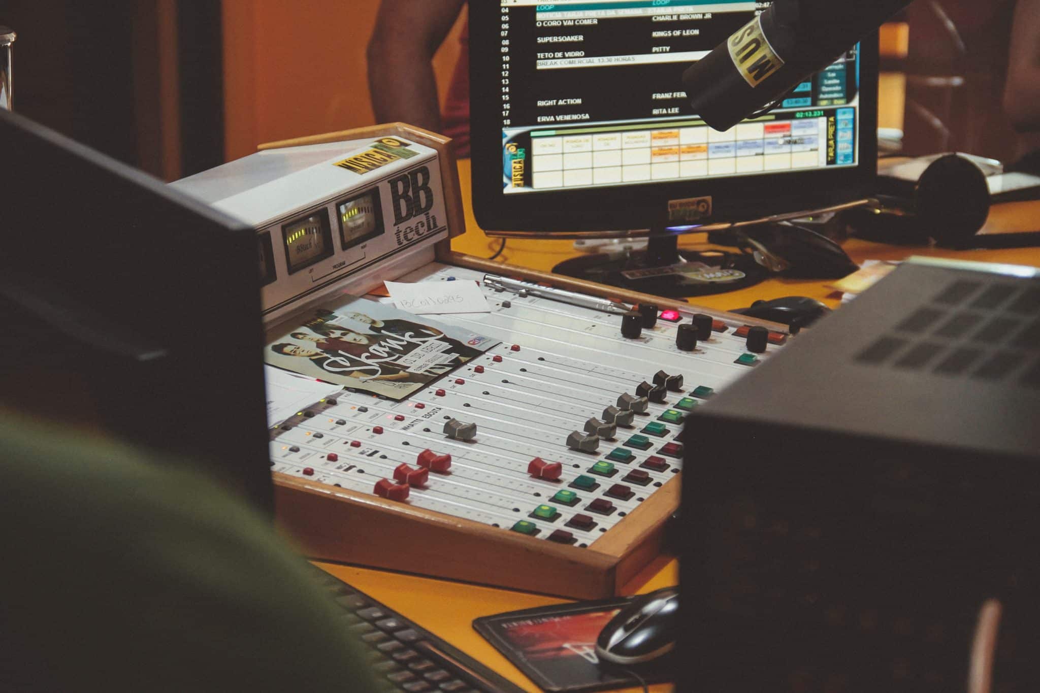 A radio station mixing board and computer