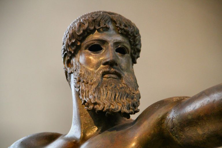 Ancient bronze statue of a Greek god