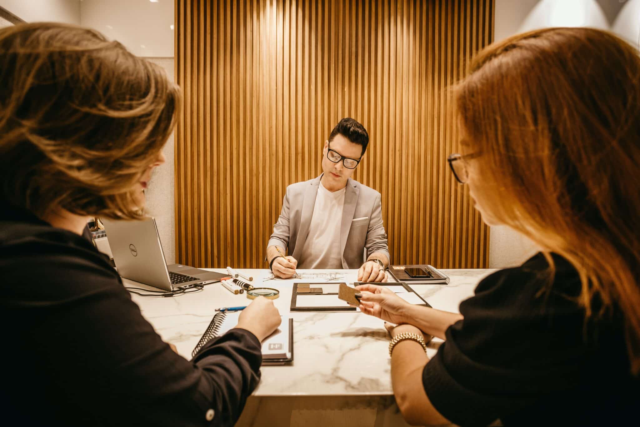 Business people sitting around a desk