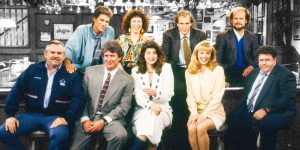 The cast of the sitcom Cheers pose in the bar