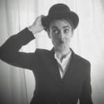 Photo of co-editor Janet Mowat dressed as Chaplin or maybe she just looks like that