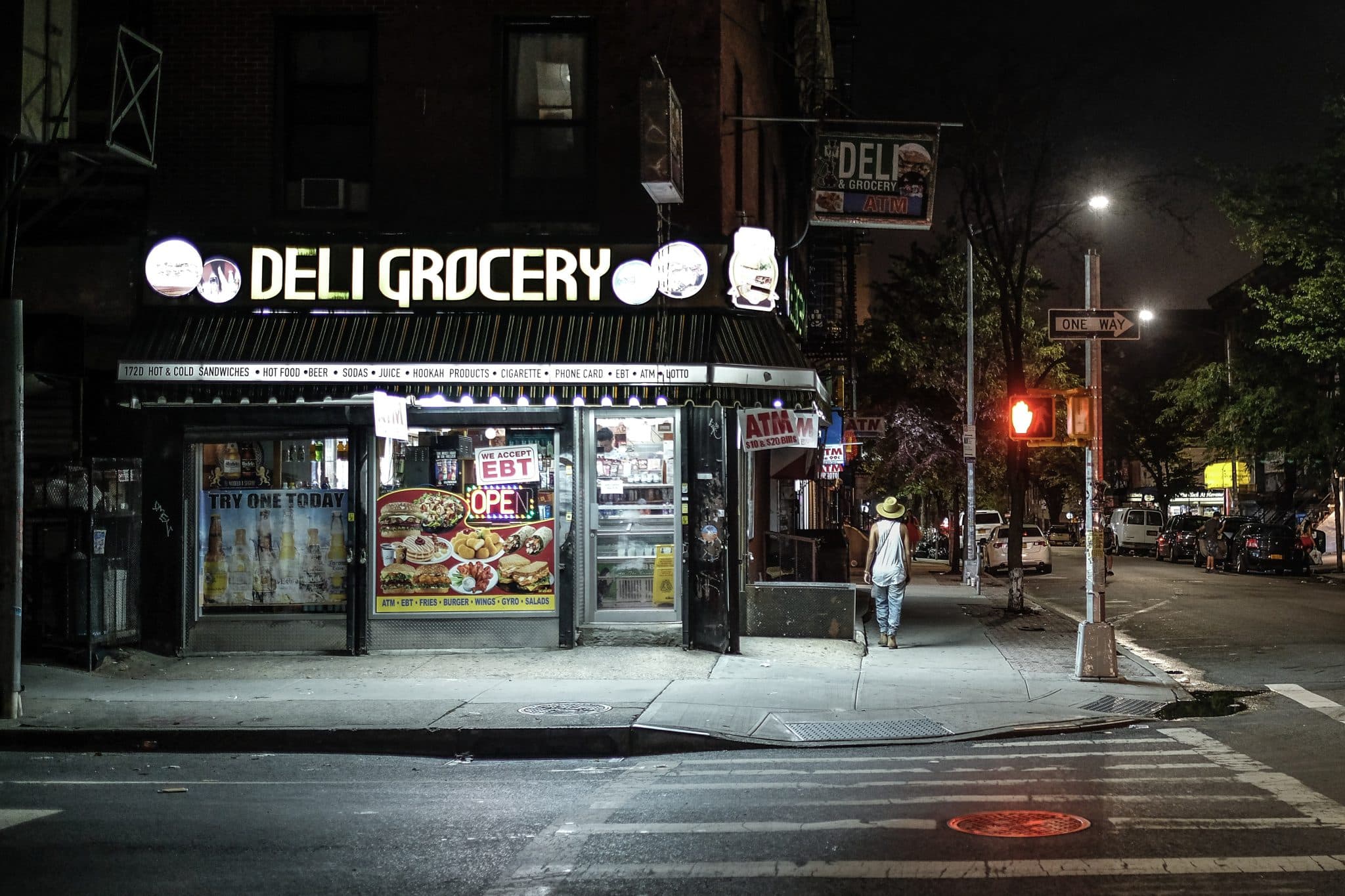 NY deli exterior at night