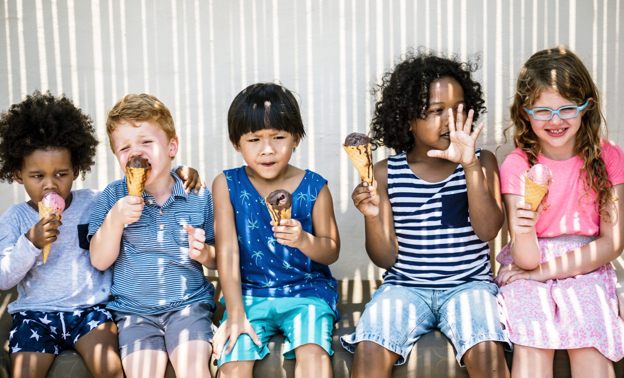 Kids eating ice cream in the summer