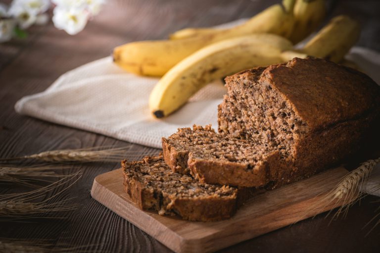 Fresh banana bread on rustic background