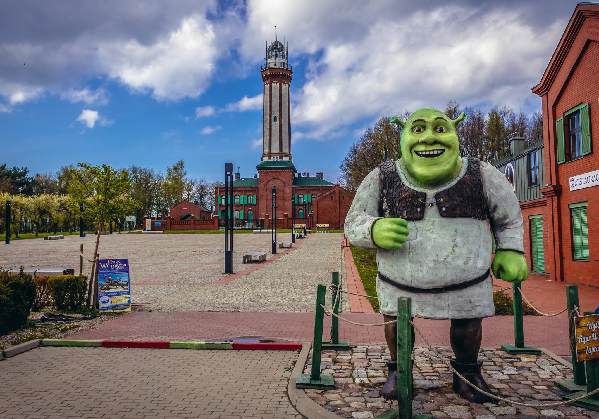 Shrek figure on the square in front of lighthouse in Niechorze, small village on the Baltic Sea coast