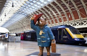LONDON, UK - NOVEMBER 4TH 2014: A sculpture of Michael Bond's fictional children's character Paddington Bear - situated in Paddington Station in London on 4th November 2014. This is one of 50 designs located across London through out November and December in celebration of the release of Paddington the movie.