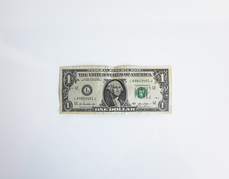 A single US dollar bill on a white background