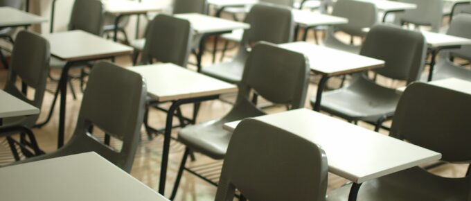 Empty classroom with desks and chairs